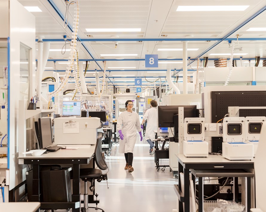 Scientists walking in a lab