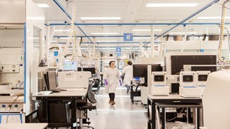 Scientists walking in a lab