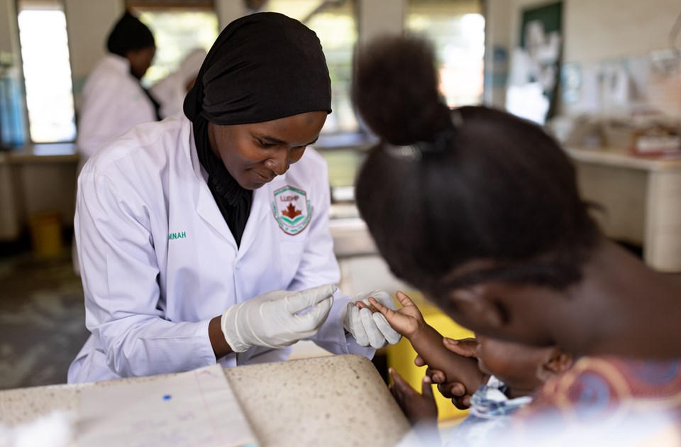 Physician administrating a vaccine to a toddler