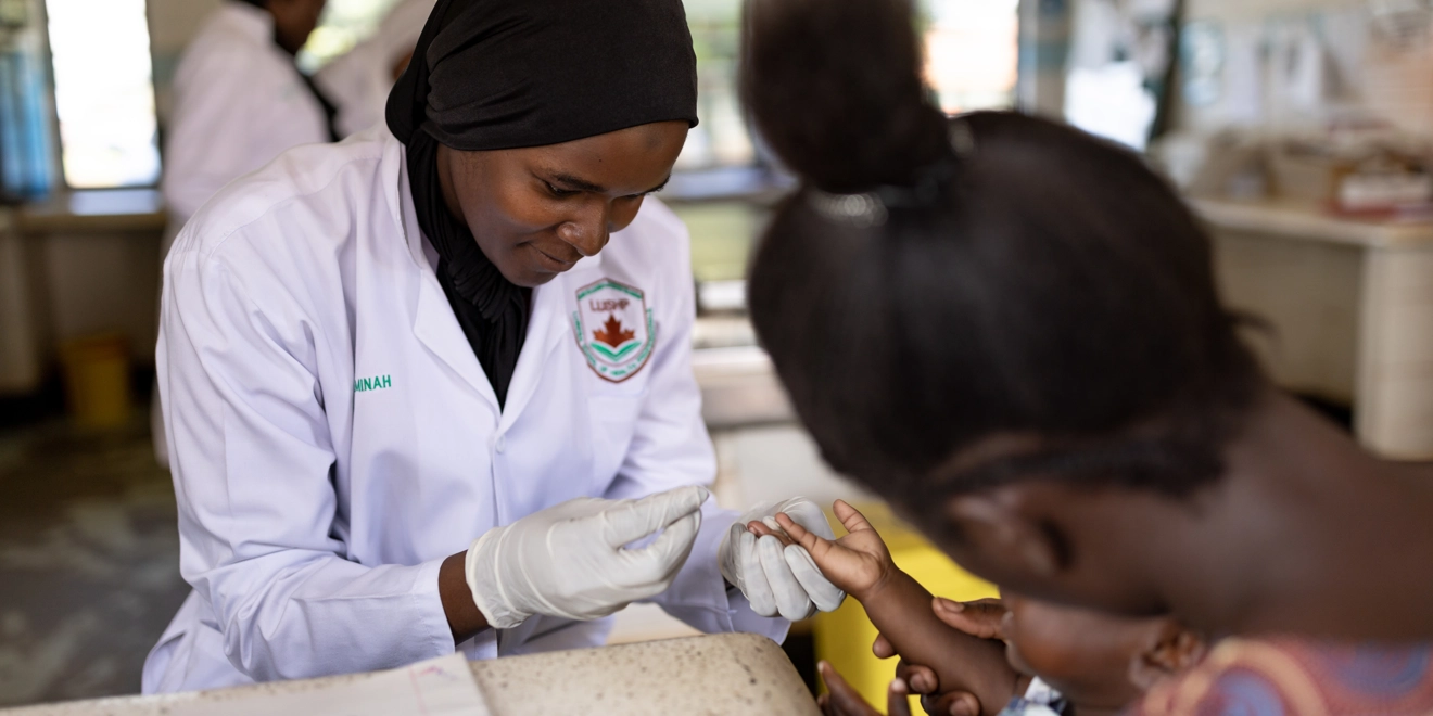 Physician administrating a vaccine to a toddler