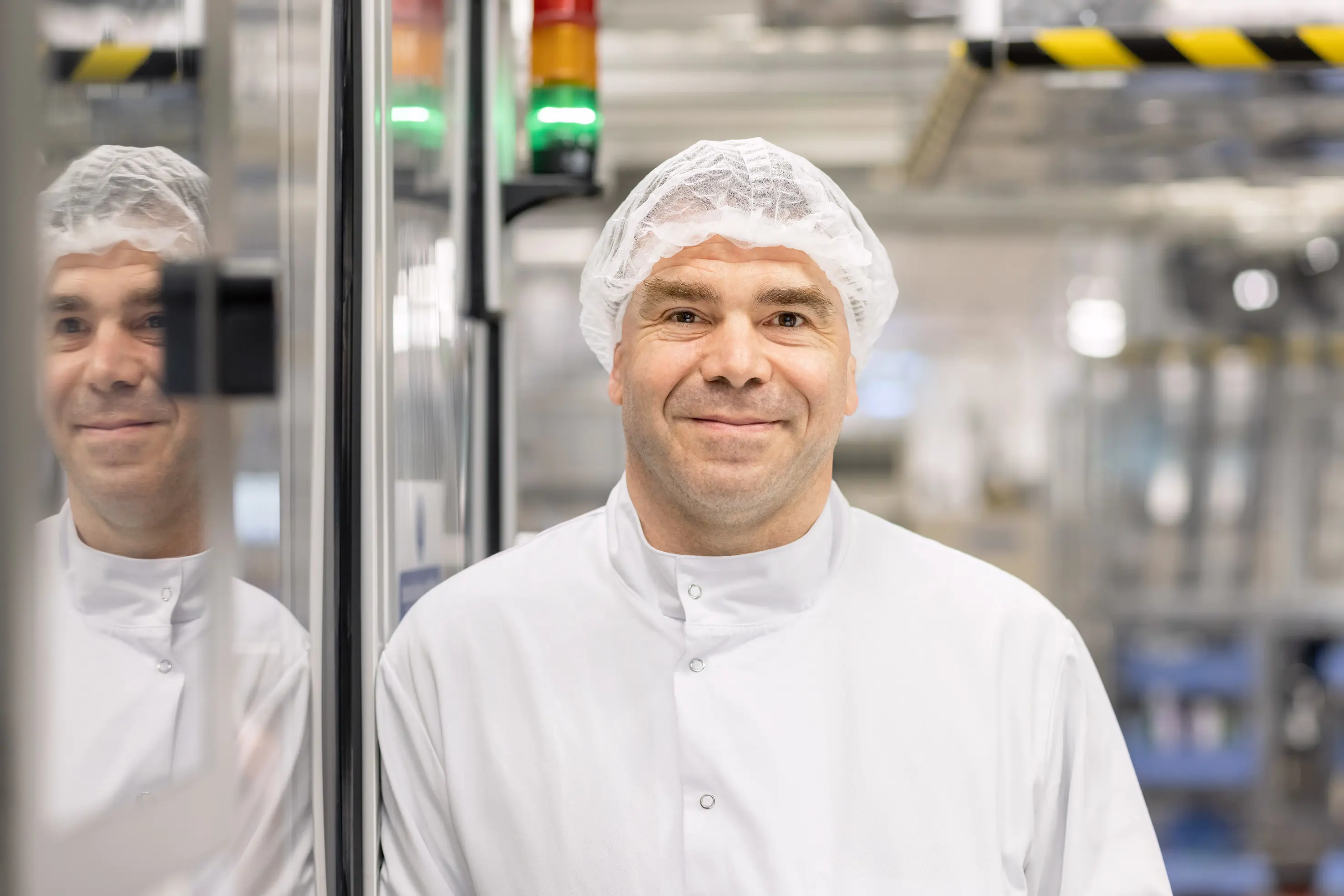 Male employees posing and smiling in a laboratory