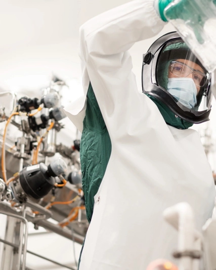 Scientist pouring a liquid into a machine