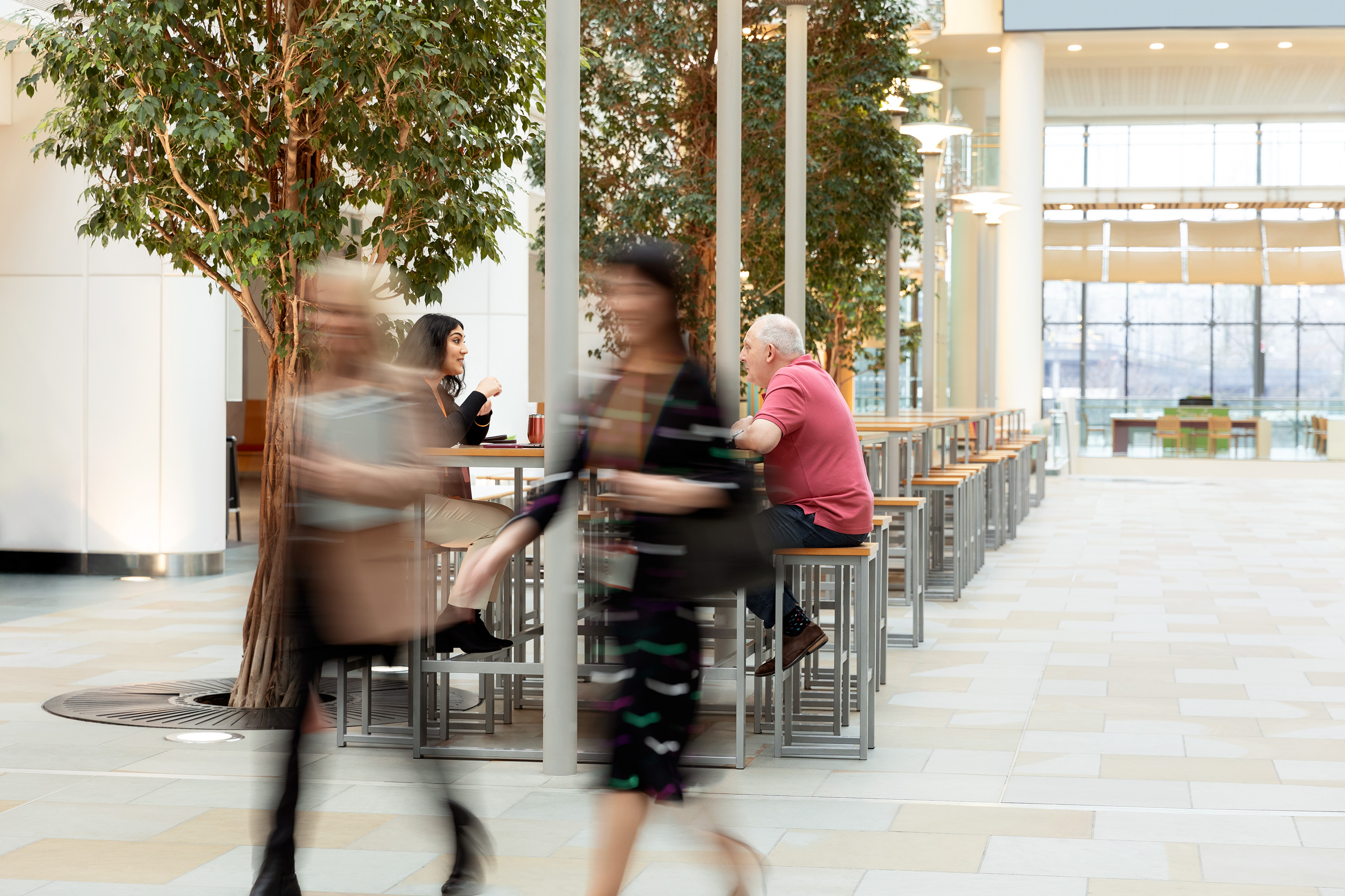Two female employees walking in a building