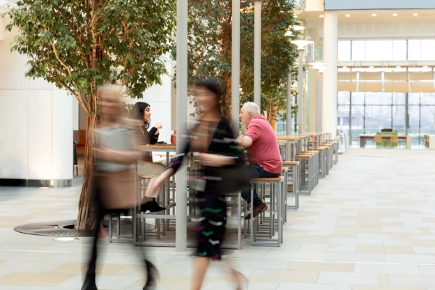 Two female employees walking in a building